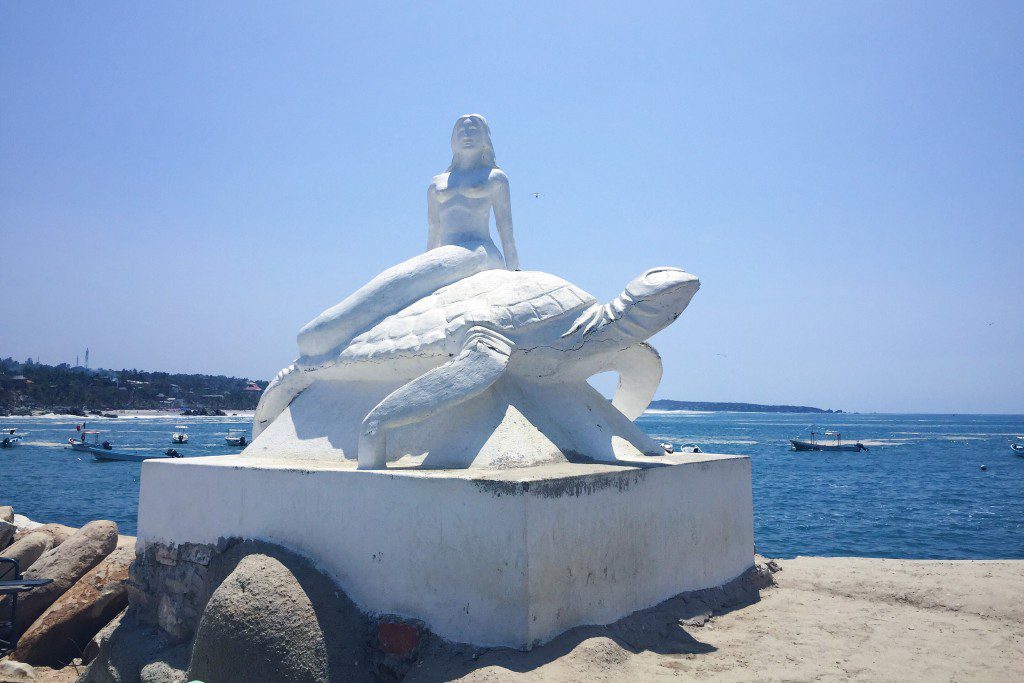 Mermaid and turtle statue at the start of the Andador walkway.