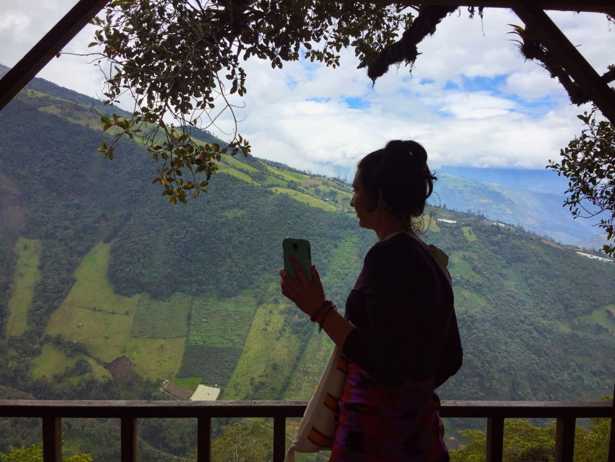 Climbing to the top of a lookout tower in Baños, Ecuador