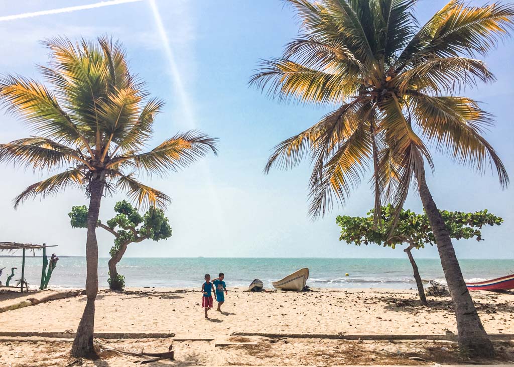 kids on beach in Rincon del Mar, Colombia