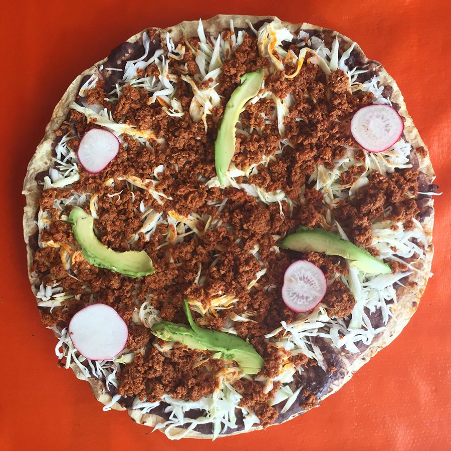 A tlayuda - the go to street food in Oaxaca, Mexico. tlayuda in Oaxaca, Mexico