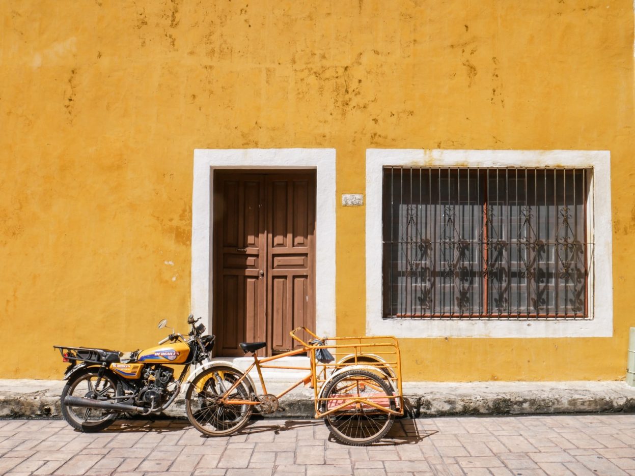 This pedi-taxi is most likely just used to transport goods around, but passenger pedi-taxi's have a bench in the front cart. pedi taxi transportation in mexico