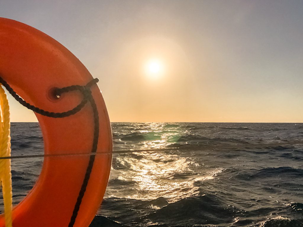 sunset on the caribbean from roatan tour