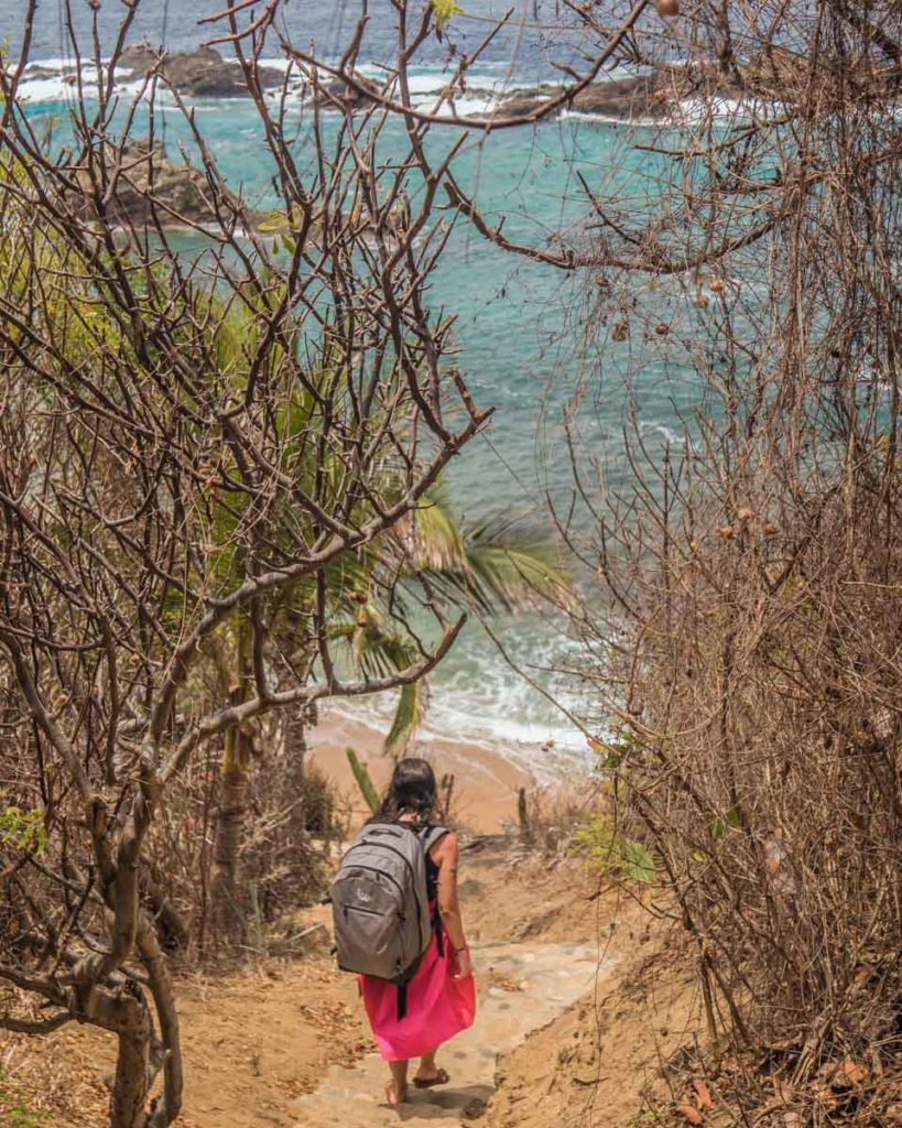 60 Liter backpack going down steps to the beach