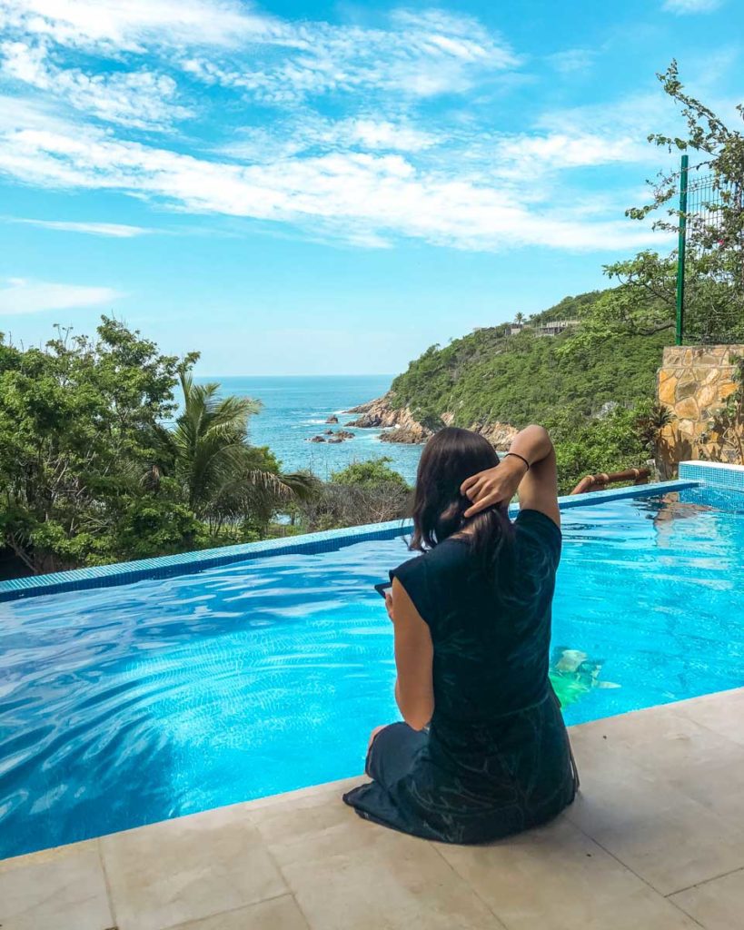 reading by the pool at playa estacahuite oaxaca